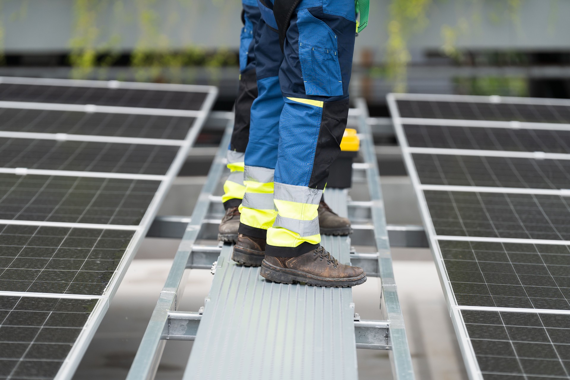 Solar panel, Solar system. Team of engineers or technicians maintaining and repairing solar power systems, inspecting quality control of solar farms on rooftop of building