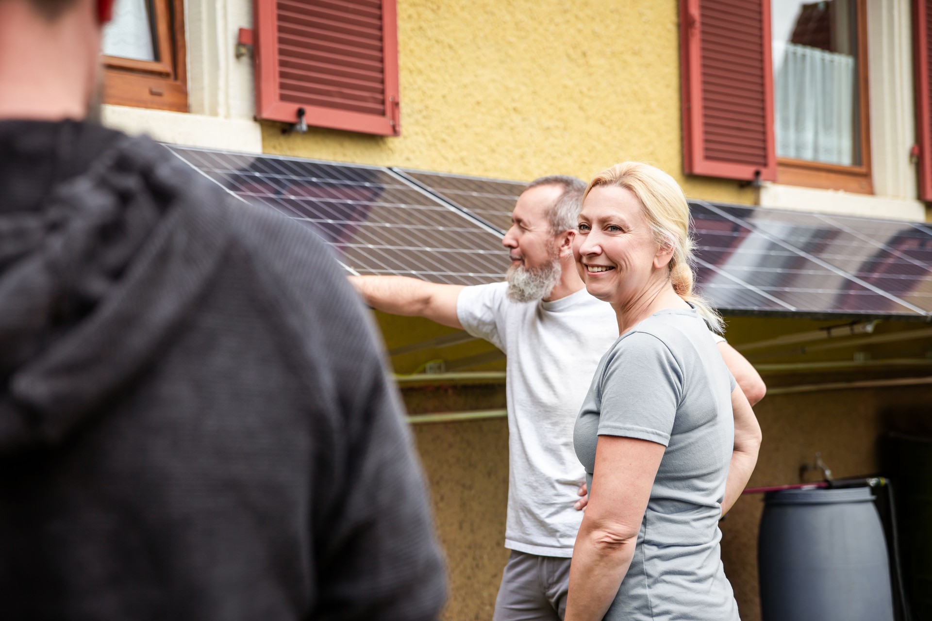 an electrician and specialist explains a newly installed pv system